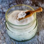 clear glass container with coconut oil